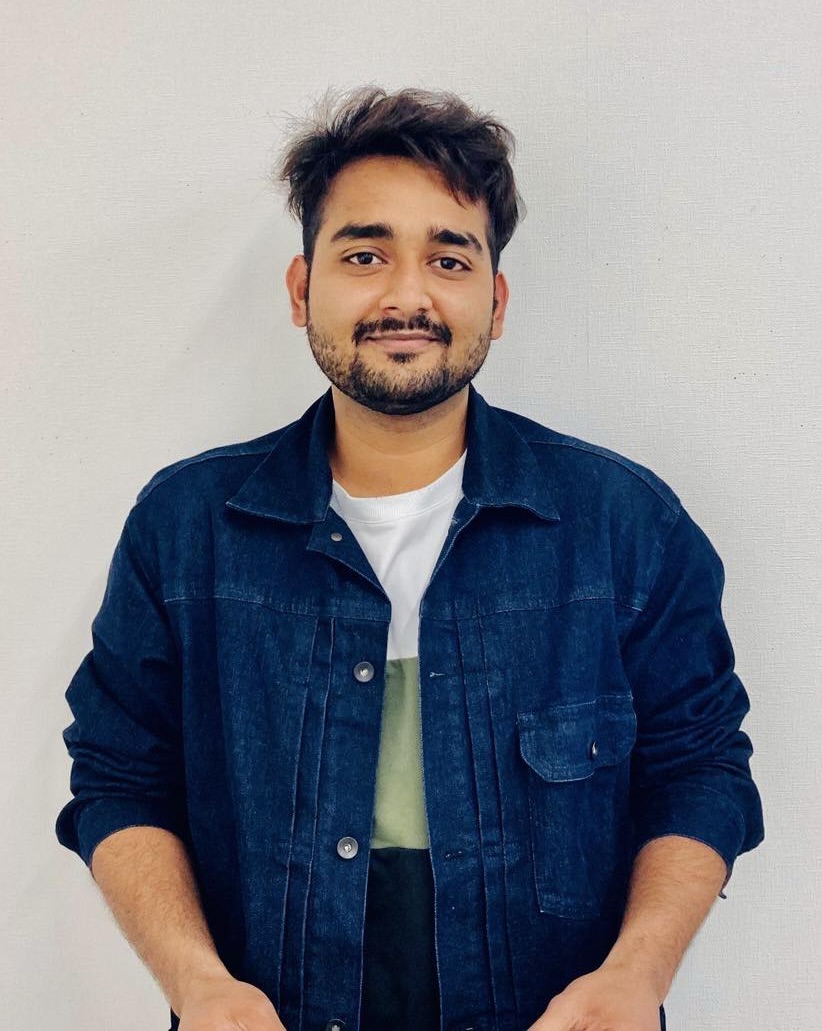 Headshot of Radwan Islam smiling against a light background.